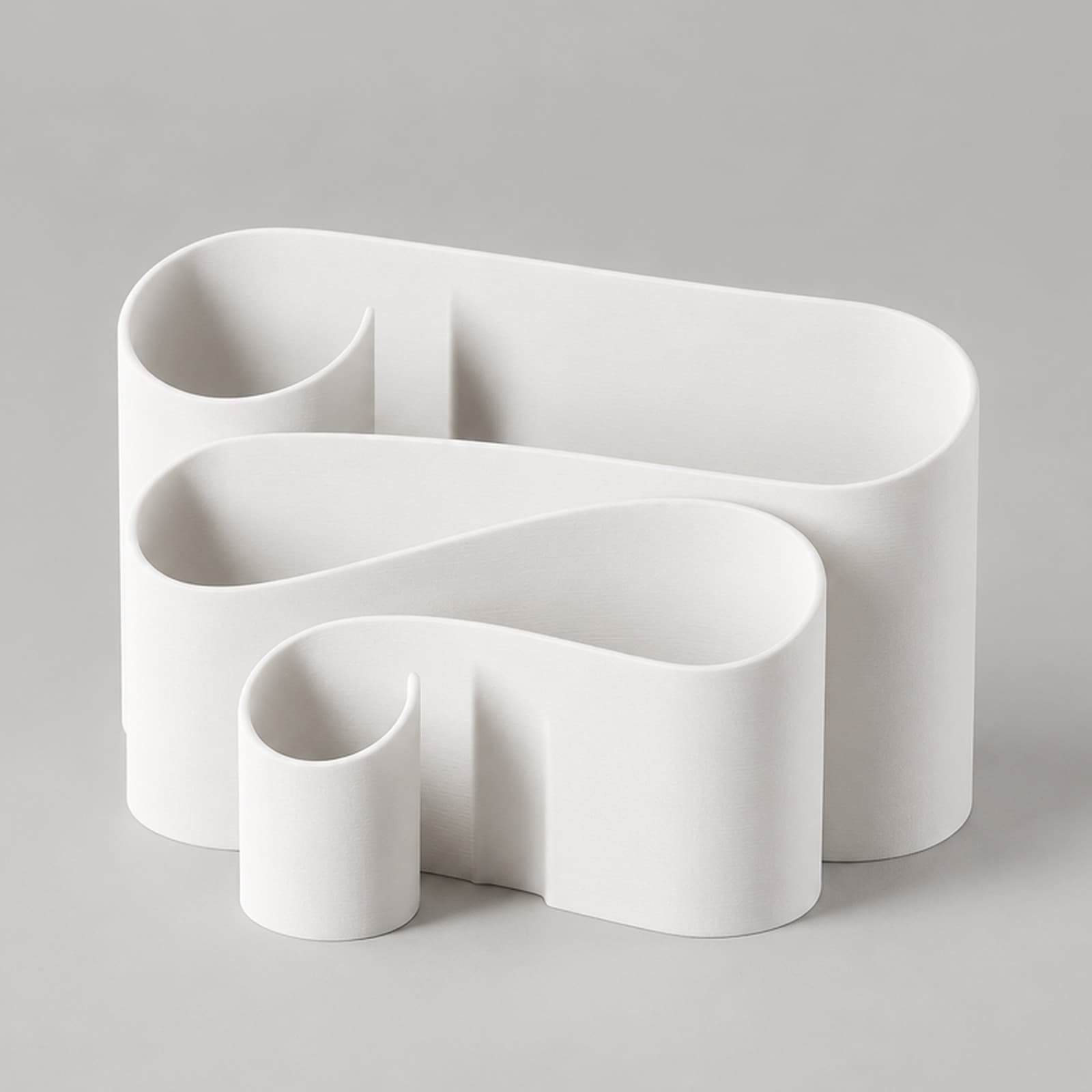 Voluta – Schreibtisch-Organizer aus einer geschwungenen Wand aus dem 3D-Druck